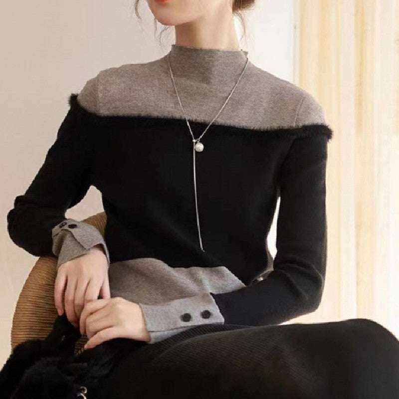 Suéter tejido de dos piezas negro y gris con diseño en capas y detalles de botones en las mangas, estilo casual elegante